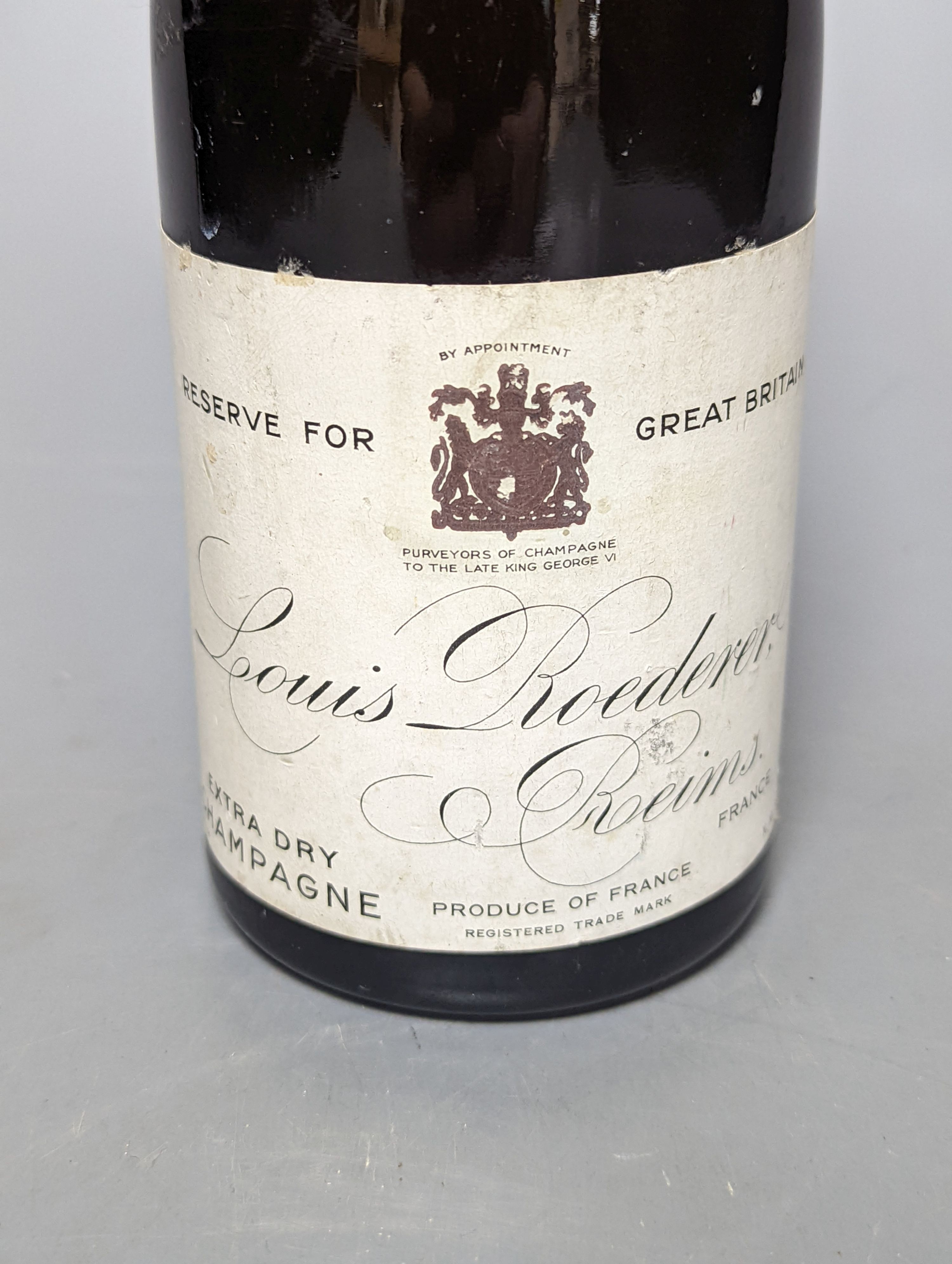 One half bottle of 1953 Louis Roederer extra dry champagne